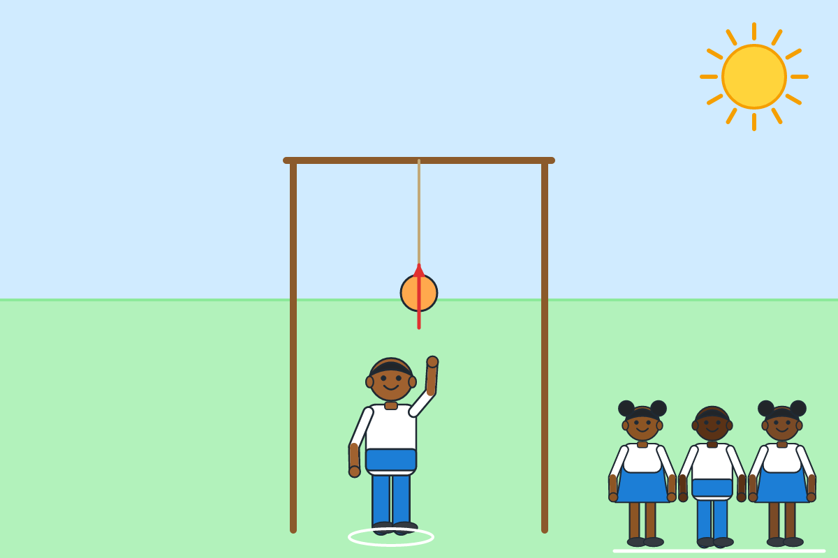 A child hitting a hanging cloth ball upwards with an open hand