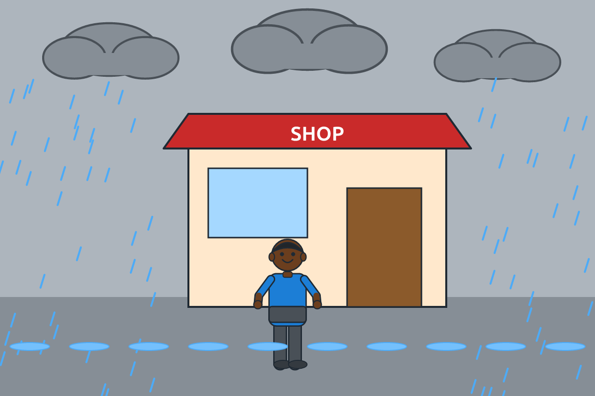 A boy sheltering from heavy rain under a shop roof