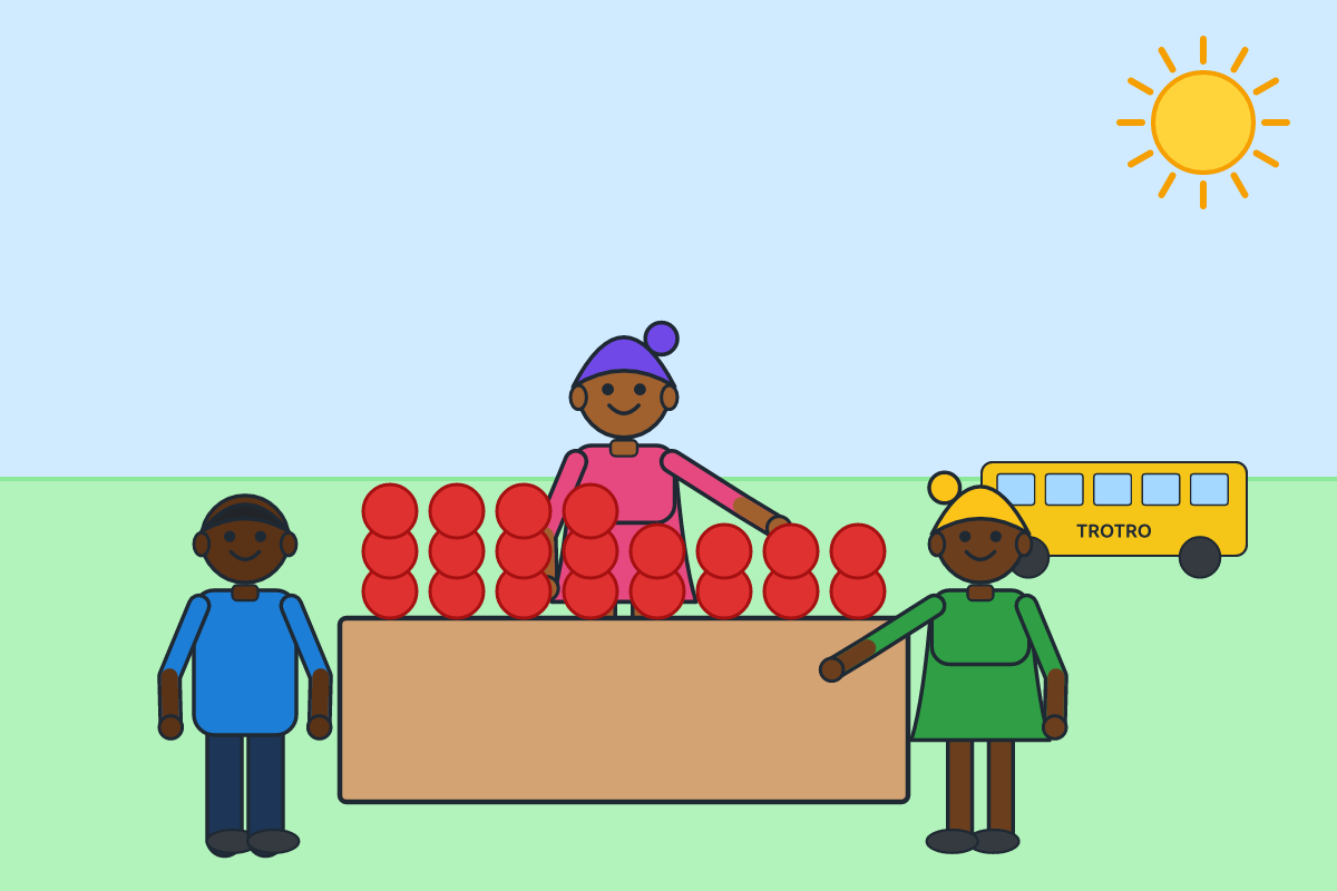 A market woman selling tomatoes at a busy market stall