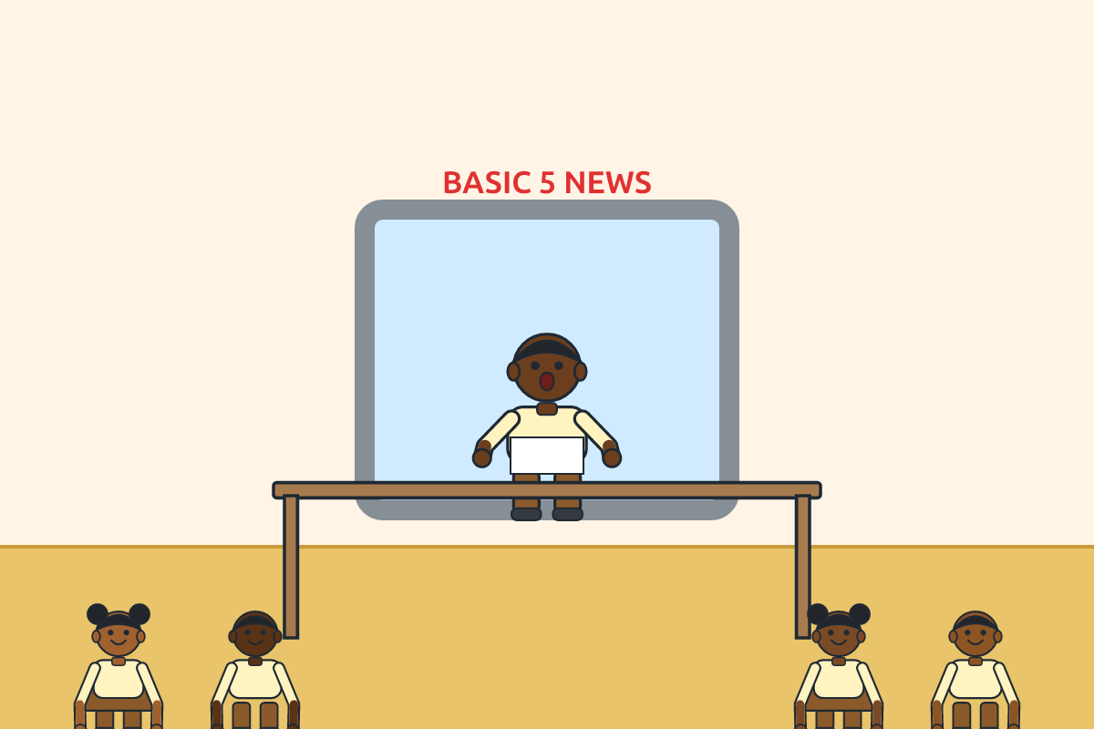 A pupil presenting news at a pretend TV desk