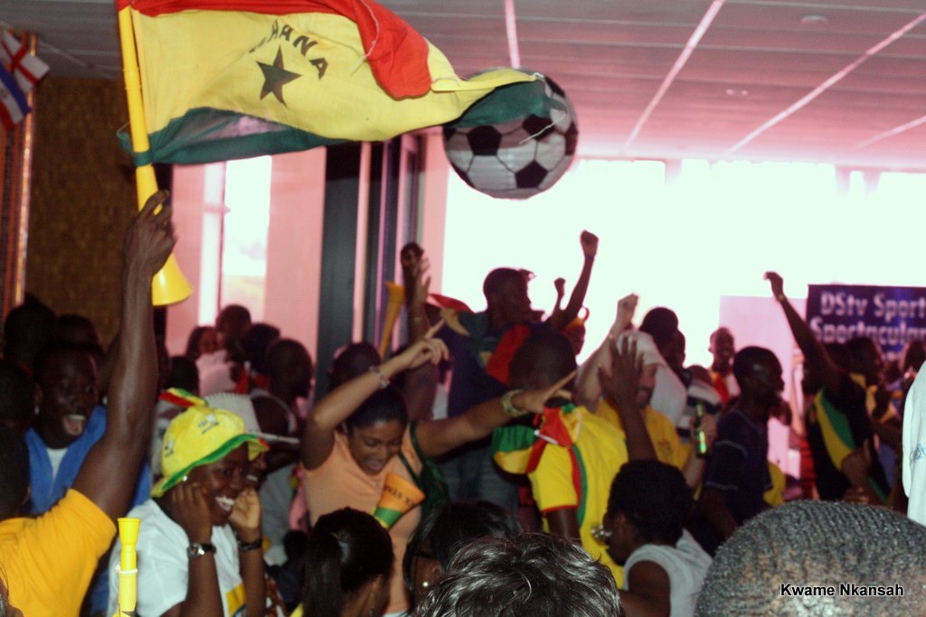 Ghana's national football team celebrating in national colours